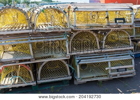 Lobster traps stacked on the dock North Rustico Prince Edward Island Canada