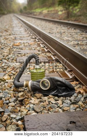 Scary authentic Russian gas mask with breathing hose abandoned in woods