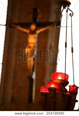Crucifix Of A Christian Church And Candlestick With Candles