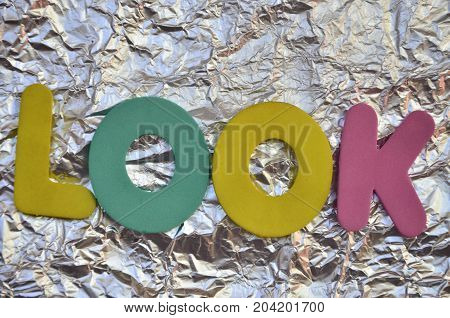 WORD LOOK ON A  ABSTRACT COLORFUL BACKGROUND
