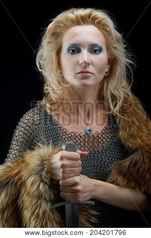 medieval Valkyrie. Viking romantic girl with sword