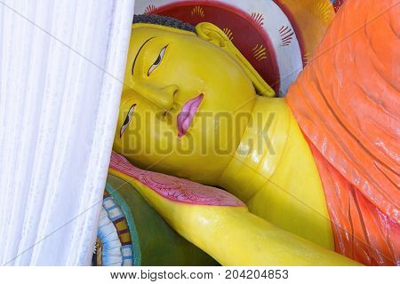 Reclining Buddha statue inside Abhayagiri Dagoba in Anuradhapura, Sri Lanka. Anuradhapura was a major monastery site of Buddhism and is one of the most extensive ruins in the world