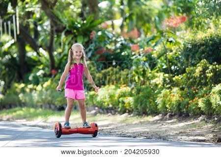 Child On Hover Board. Kids Ride Scooter.