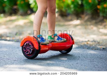 Child On Hover Board. Kids Ride Scooter.