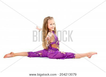 young girl doing gymnastics over white isolated,