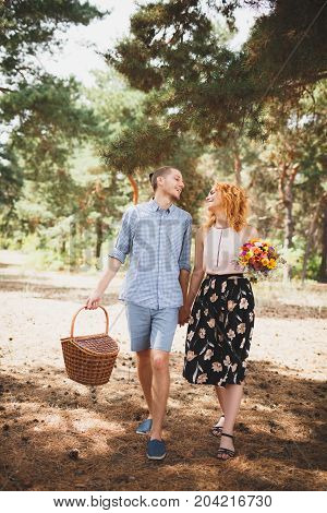 Happiness and love are in the air. Woman and man in the forest. Outdoors concept.