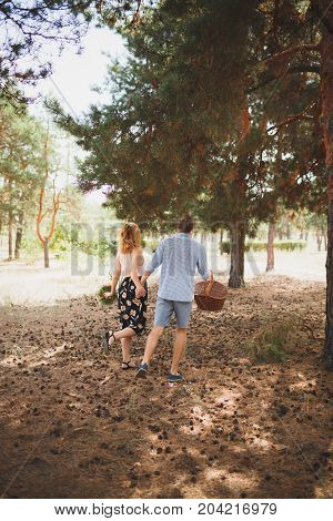 Happiness and love are in the air. Woman and man in the forest. Outdoors concept.