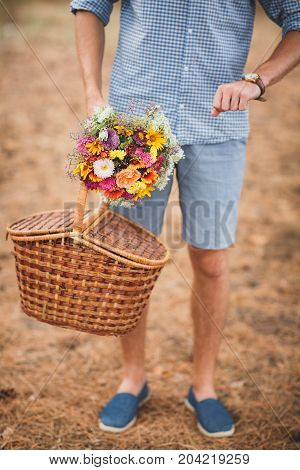 Close-up photo of body parts cute boy. with bright gift, standing in the forest. Lifestyle concept.