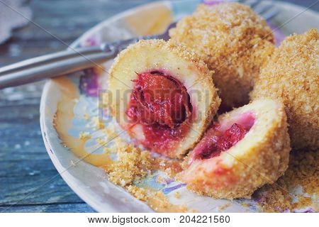 Top View Of A Colorful Plate With Plum Dumplings