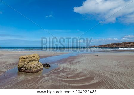 Achnahaird Bay Beach and sands on a beautiful day.