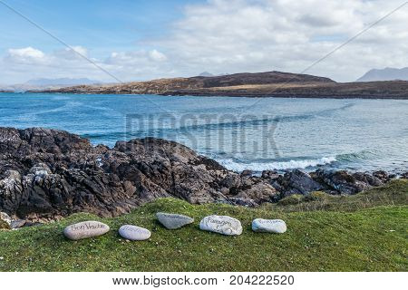 Achnahaird Bay with stones naming the surrounding mountains.