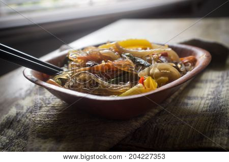 Korean Japchae vegetarian stir fried cellophane noodles with vegetables