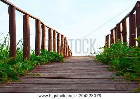 picture took of a bridge ,from the street to the beach