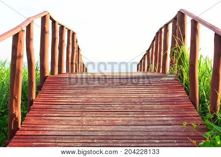 picture took of a bridge ,from the street to the beach