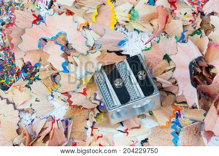 Color shavings and metal sharpener on it