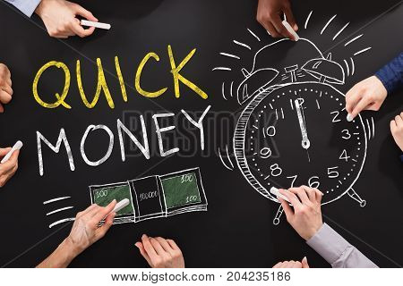 Hand Drawing Quick Money Concept On Blackboard