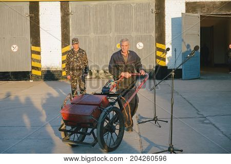ZHYTOMYR, UKRAINE - Oct 10, 2014: Russian armored personnel carrier with a weapon and tanks in the hangar
