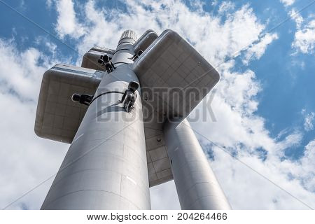 Prague, Czech Republic - August 21, 2017: Zizkov Television Tower in Prague. It is is a  transmitter tower and an example of high tech architecture. Low angle view a cloudy day of summer.