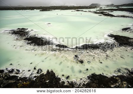 Blue lagoon in Iceland colorful hot springs tourist attraction.
