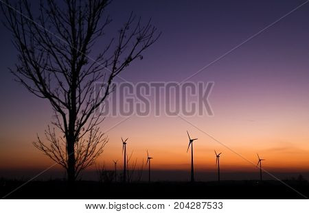 Color of Sunset with some windmill in the distance