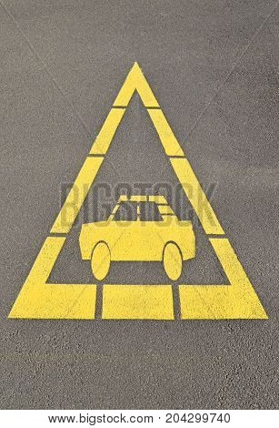 Car sign at the road crossing danger