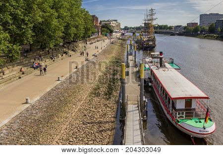 BREMEN, GERMANY - AUGUST 23, 2017: Promenade along the river Weser in Bremen, Germany
