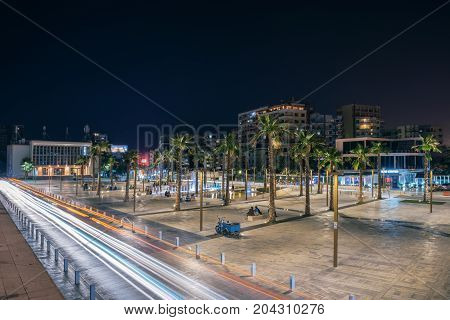 ALBANIA DURRES - September 22 2015: Evening view of the main square of the city Illyrian (sheshi Iliria) the Alexander Moissi Drama Theater (1953) and fountains illuminated by colorful lights