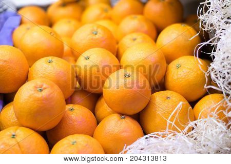 Heap of fresh oranges in the food market.