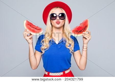 Beauty Blonde Woman With Watermalon In Hands In Stylish Color Summer Clothes And Sunglasses On Gray