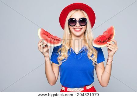 Beauty Blonde Woman With Watermalon In Hands In Stylish Color Summer Clothes And Sunglasses On Gray