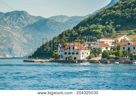 View on the coast from ferry transporting cars and people in Lepetane, Tivat, Montenegro.