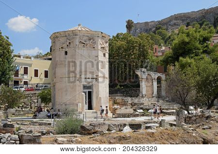 ATHENS GREECE - AUGUST 4 2016: People visiting tower of the winds. Ancient agora of Athens Greece.