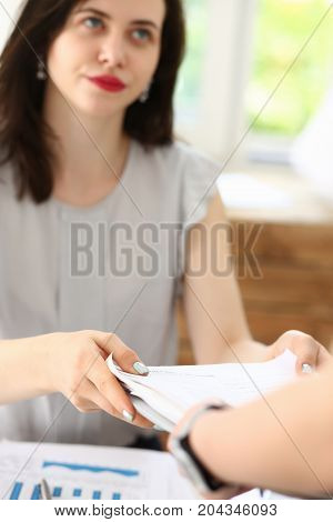 Female Employee Show Pack Of Documents To Manager