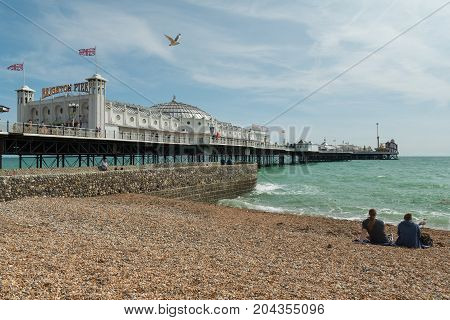24 of August, 2017, Editorial photo of Brighton Pier and beach, Brighton, UK, Great Britain England