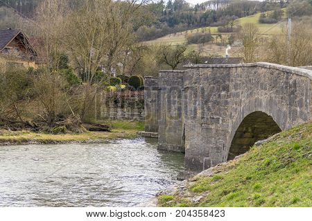 historic stone bridge at a small rural village named Oberregenbach near Langenburg in Hohenlohe a area in Southern Germany