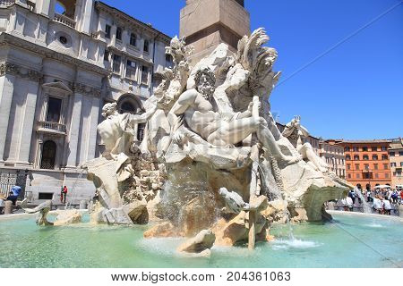 ROME, ITALY - JULY 16, 2017: View of the Fountain of the Four Rivers in Piazza Navona Rome in the historic center of Rome, Italy