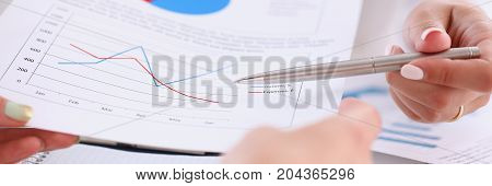 Businesswoman Holding A Silver Pen In Her Hand