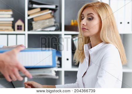 Female Employee Show Pack Of Documents To Manager