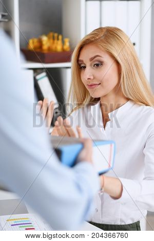Female Employee Show Pack Of Documents To Manager