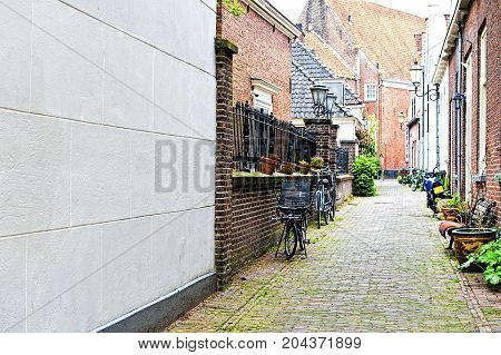 Typical Dutch brick houses in Holland. Street View with bikes parked in the historical center of Amersfoort in the Netherlands