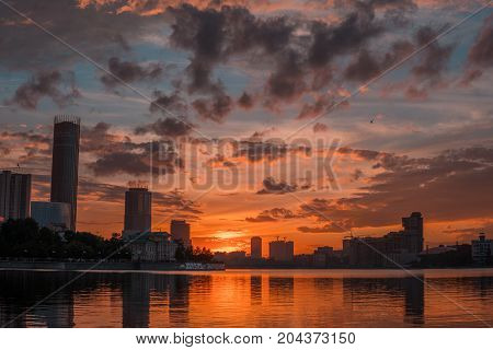 Yekaterinburg City Center On Sunset. City Pond View, Amazing Clouds And Sky. High Buildings, Skyscra