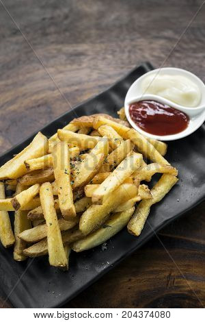 french fries chips side snack with diping sauces on wooden table