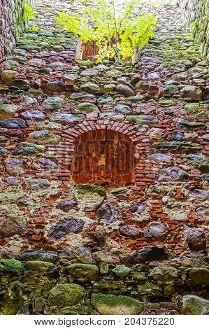 very old Kazdangas church wall of stones.