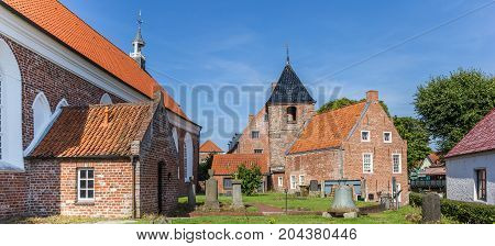 GREETSIEL, GERMANY - JULY 18, 2017: Panorama of the historic church in Greetsiel, Germany