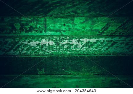 Old green vintage wood. Dark green vintage wood texture and background. Abstract texture and background for designers. Old vintage wood paint in dark green. Rough green wood background and texture