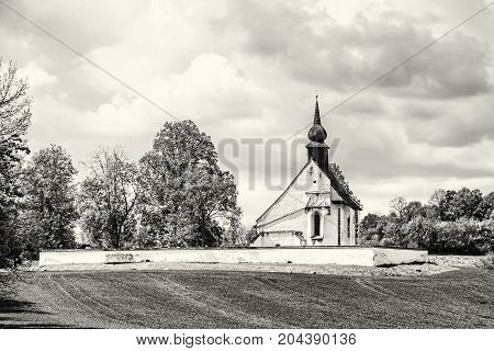 Chapel of Our Mother God near Veveri castle Moravia Czech republic. Religious architecture. Travel destination. Black and white photo.
