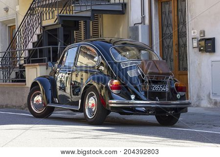 LASTRA A SIGNA, ITALY - AUGUST 30 3015: Black vintage Beetle parked on the street in Lastra a Signa Tuscany