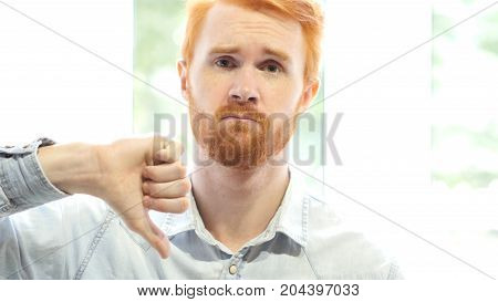 Poor Performance, Disliking Idea, Thumbs Down By Young Red Hair Beard Man