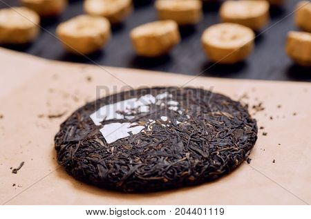 Selective focus on Tea cake traditional chinese puer drink in different forms and the sorts. Popular antioxidant from China.