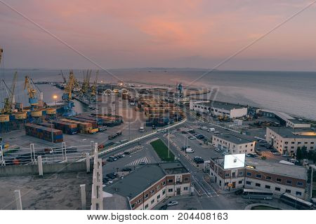 ALBANIA DURRES - September 22 2015: Top view of the terminal for receiving cargo and sea containers. On the site there are tower cranes and trucks for transportation of cargo.